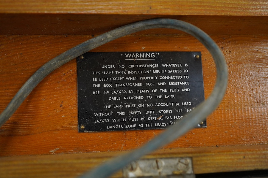 An Air Ministry First World War cased tank inspection lamp, 78cm long, together with a cased Air Ministry Interception Calculator, plywood case; 71cm wide, 24cm deep, 24cm high. Condition poor to fair.